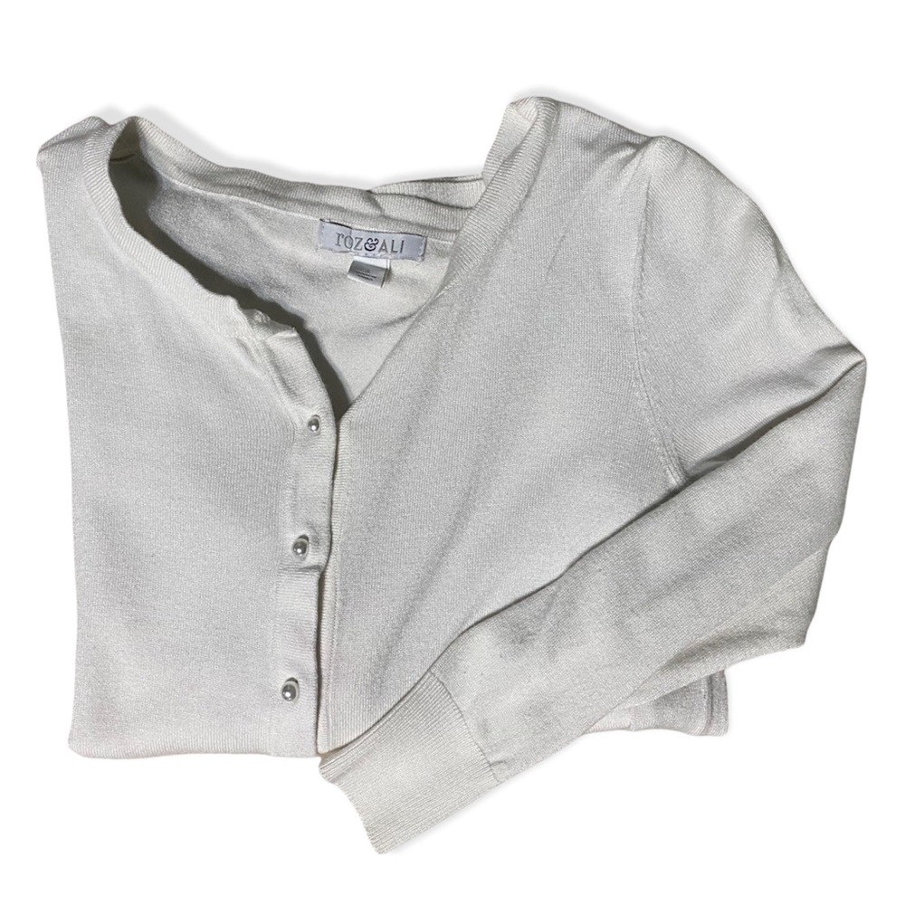white cardigan with pearl buttons